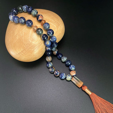 ORANGE SODALITE, RABBIT HAIR QUARTZ PRAYER BEADS